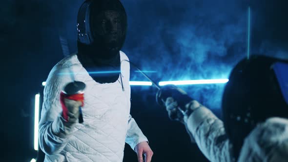 Male Fencer is Getting Attacked By His Opponent alt