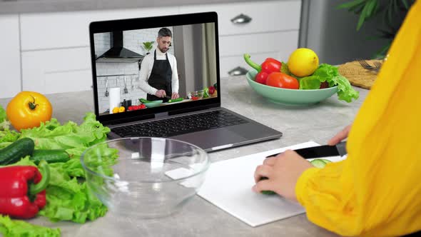 Man Food Blogger in Laptop Screen Tells Teaches Housewife Remote Cooking Course alt