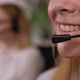 Close Up of Unrecognisable Woman Speaking in the Headset - VideoHive Item for Sale