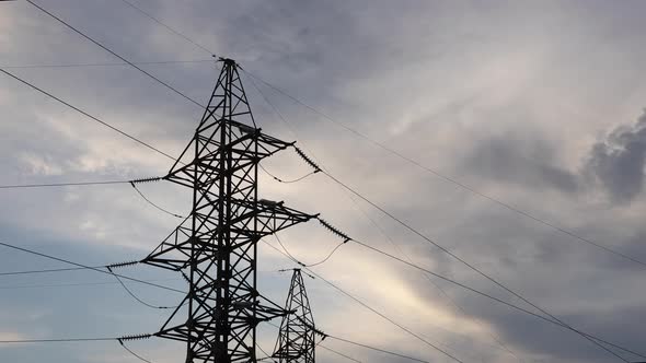 Power Transmission Line With Cloudy Sky On The Background alt