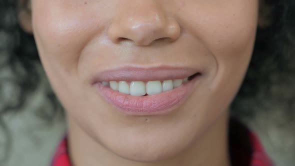 Close Up of Smiling Mouth of African Woman alt