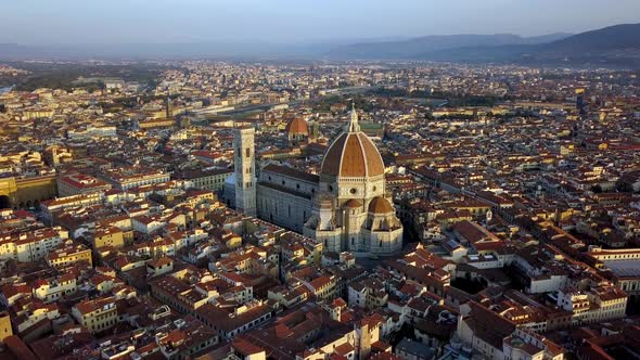 Duomo Cathedral of Santa Maria del Fiore in Florence Italy wide view, Aerial circling shot alt