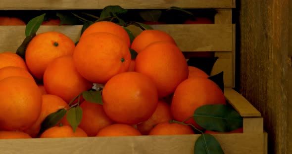 Raw Oranges In Rustic Wooden Box. alt