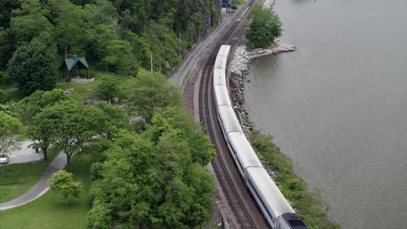 Flying Over Passing Train by the Hudson River alt