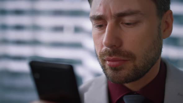 Portrait Boss Man Browsing Surfing Internet Using Smartphone in Office Workplace alt