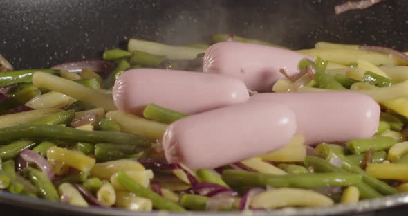 Cooking In A Pan. Throw Asparagus With Sausages. Cooking
