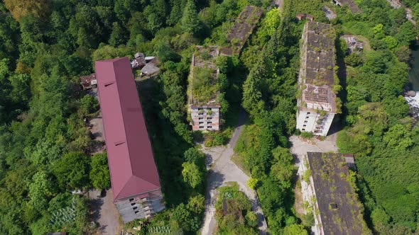 Ruined Lost Overgrown Mining Ghost Town Akarmara Consequences of War in Abkhazia Aerial View From alt