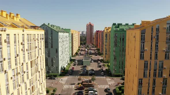 Modern Smart City Block Aerial with a Street full of Cars