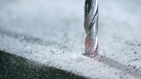 Super Slow Motion Detail Shot of Drilling Concrete at 1000 Fps alt