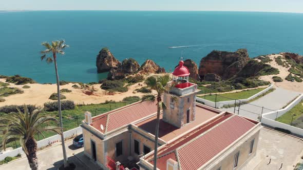 Close view of Ponta da Piedade Lighthouse over stunning headland in Lagos, Algarve, Portugal alt