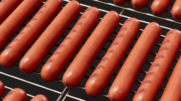 Animation of grilling sausages. Roasted rotating sausages on the grill. Barbeque alt