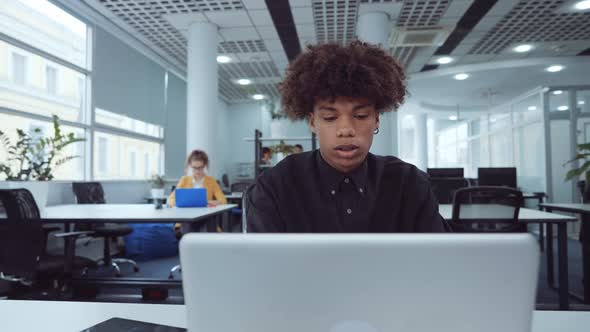African American Employee Working on Laptop in Office alt