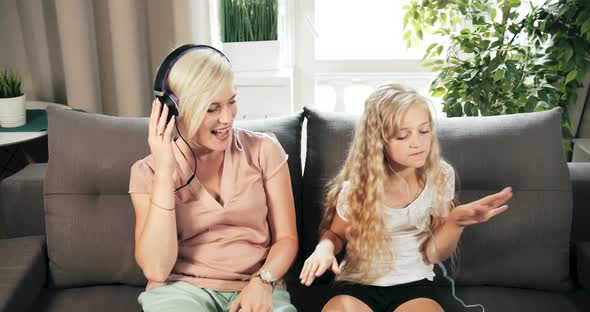 Mother and Daughter Listening To Music