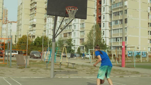 Streetball Player Practicing Ball Handling Skills alt