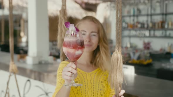 Portrait of Beautiful Woman on Vacation Enjoy Fruitshake alt