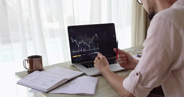 A Cropped Bearded Analyst is Nervous Looking at the Falling Trading Chart