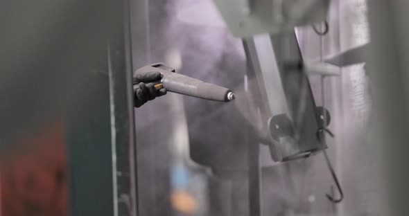 Spraying Powder Paint On Metal Products With Powder Coating Gun alt