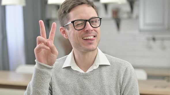 Victory Sign By Successful Young Man alt