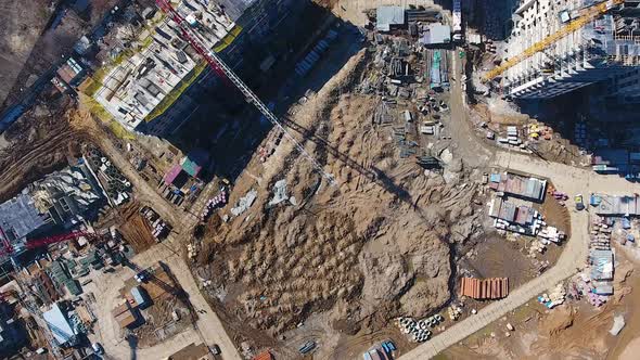 Drone Flies Over a Construction Site Near Moscow. Construction Cranes in the Industrial Zone