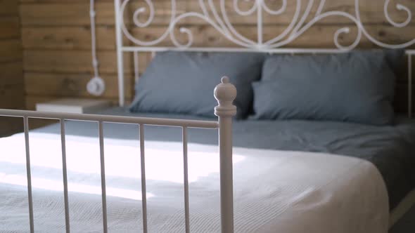 wrought iron bed in a wooden house