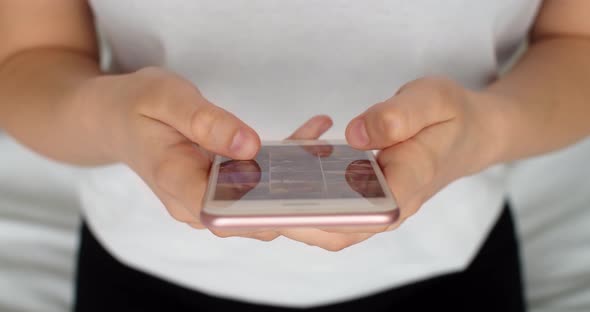 Closeup Shot of Hands Using Smartphone Surfing in Internet