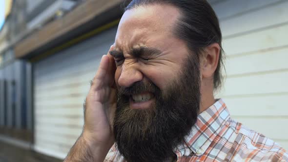 Caucasian Man Touching Head in Morning, Suffering Headache After Party, Hangover