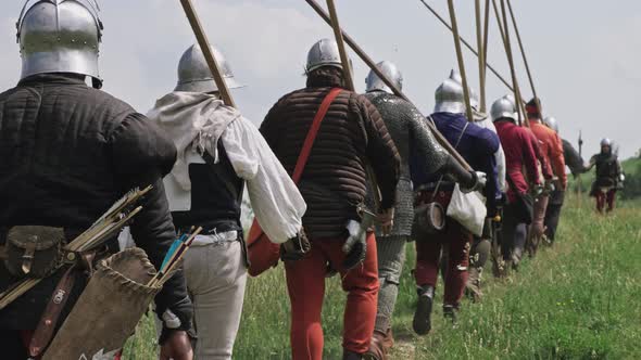 Back view of group medieval knights going on the battle. Military ...