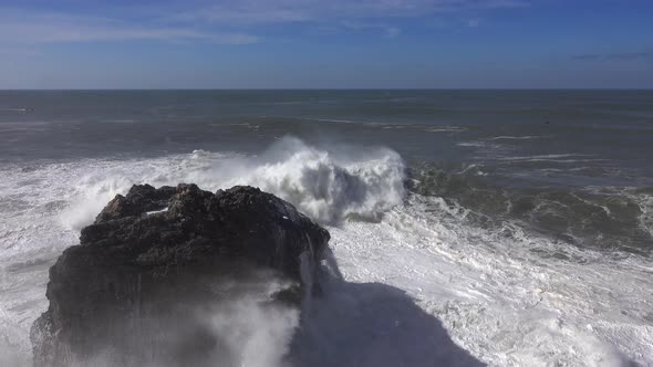 High Waves Breaking on the Rocks of the Coastline alt