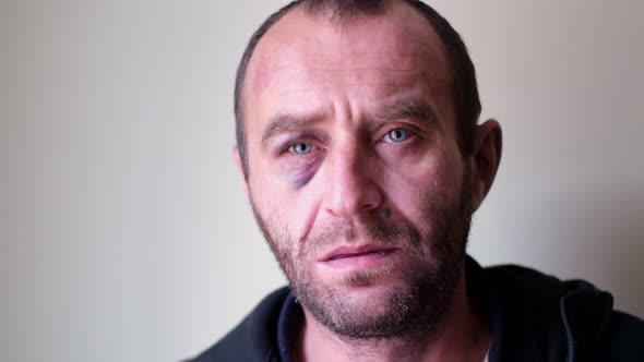 Portrait of a Tired Man Looking at the Camera alt