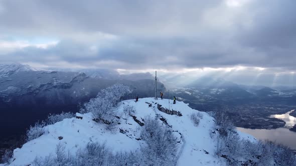 Group of hikers reaching mountain summit at Orobie Alps, Italy alt
