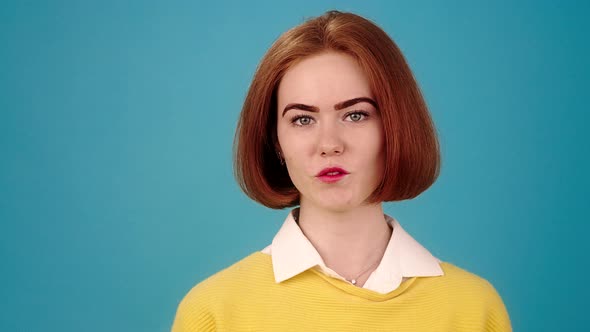 Shy Young Woman Looks Speaking alt