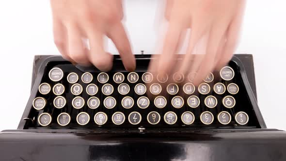 Hands Typing on Old Typewriter alt
