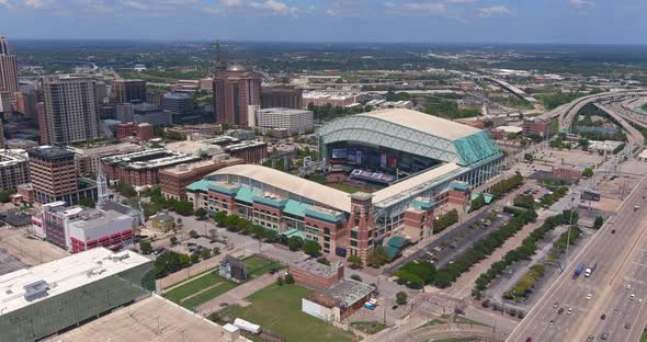 Aerial view of parts of downtown Houston on a bright but cloudy day. This video was filmed in 4k for alt