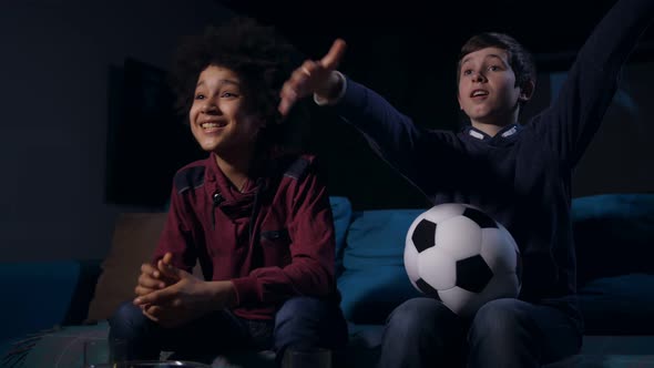 Teen Boys Expecting Goal Watching Football Match alt
