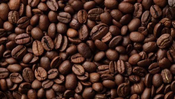 Zoom Dark roast coffee beans top view, rotate alt