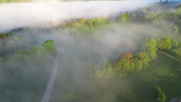 Flying over the foggy countryside alt
