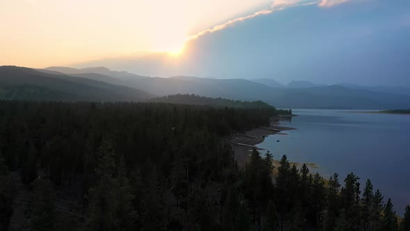 Sunset aerial view with boat docks lying on the shore of a lake during drought alt