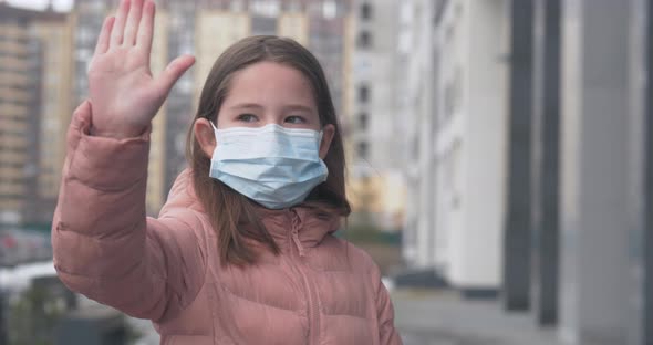 A Girl Wearing Mask Shows Stop Hands Gesture for Stop Corona Virus Outbreak