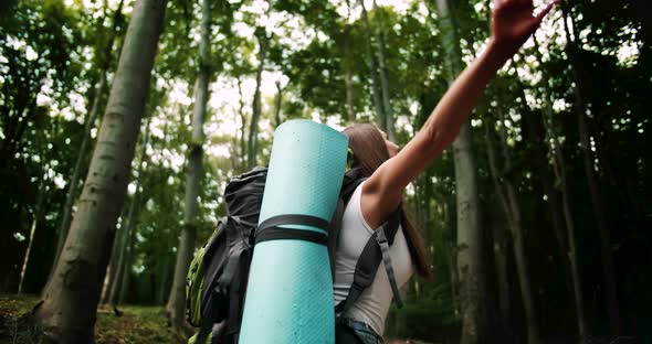 Woman Tourist Spinning Around Enjoying Forest