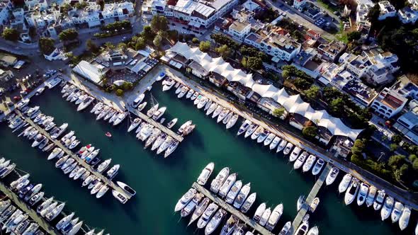 View from drone on full of yachts Bodrum harbour and ancient Kalesi castle in Mugla in Turkey alt