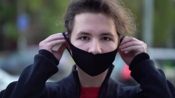 Portrait of a Teen in the City Streets During the Day, Wearing a Face Mask Against the Second Wave
