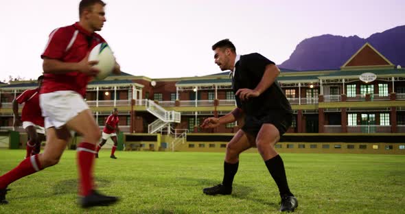 Male rugby players playing rugby in the stadium 4k