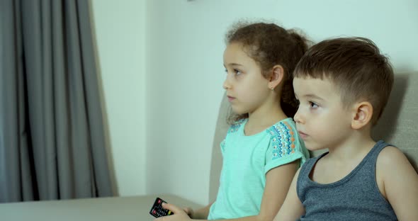 Portrait Cute Little Kids While Watching TV on Laptop alt