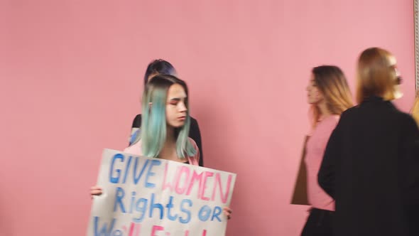 Young Confident Women Fighting for Women Rights Holding Posters alt