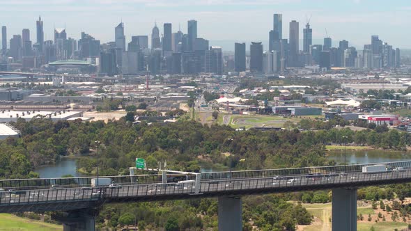 Traffic on Bridge - City Skyline (Drone Shot)