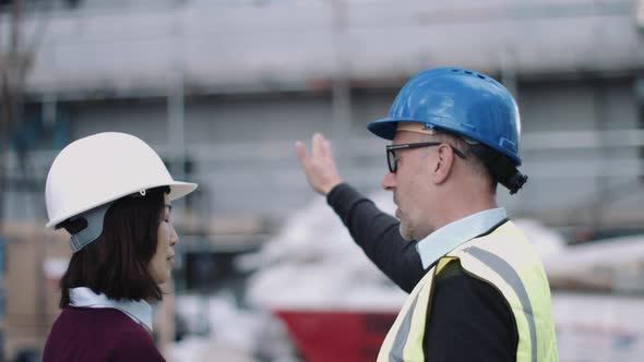 Construction workers looking at project development