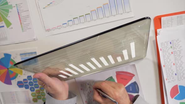 Tablet With Business Charts  alt