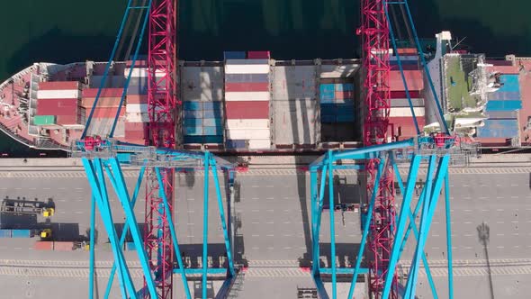 Drone Flying Over a Container Ship During Cargo Operations Over the Customs Area alt