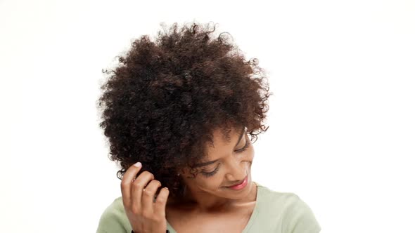 Shy Young Beautiful African Girl Smiling Over White Background alt