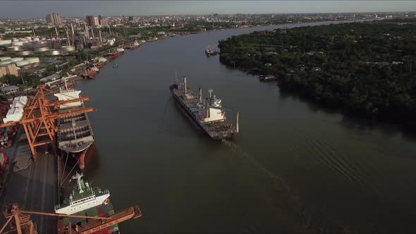 Logistic concept aerial View of maritime transport commercial dockyard with cargo ships, containers alt